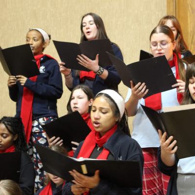 Academy of the Holy Family students performing at the Christmas concert by Academy of the Holy Family